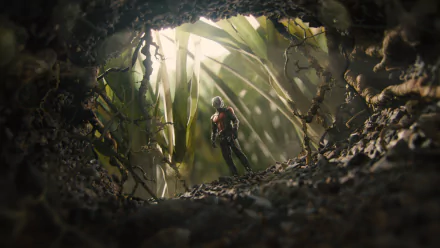 A captivating HD wallpaper from the movie Ant-Man, showing the character standing amid towering foliage, captured from a unique perspective that emphasizes the scale of the environment.