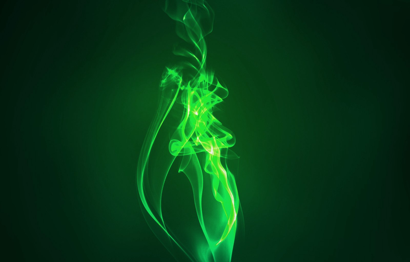 A captivating digital artwork featuring swirling green elemental forms against a dark background, creating an artistic and dynamic visual experience for a PC desktop wallpaper.