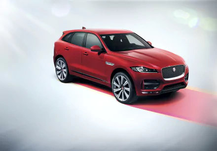 Red Jaguar F-PACE SUV showcased in a sleek 4K Ultra HD PC desktop wallpaper, highlighting the vehicle's modern design and dynamic presence.