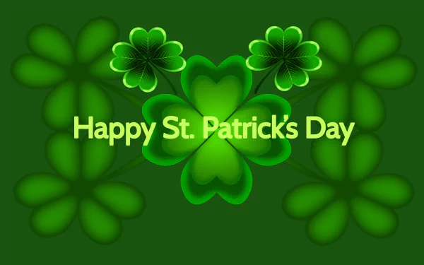 HD desktop wallpaper featuring vibrant green clovers with Happy St. Patrick's Day text, celebrating the holiday with a festive and cheerful design.