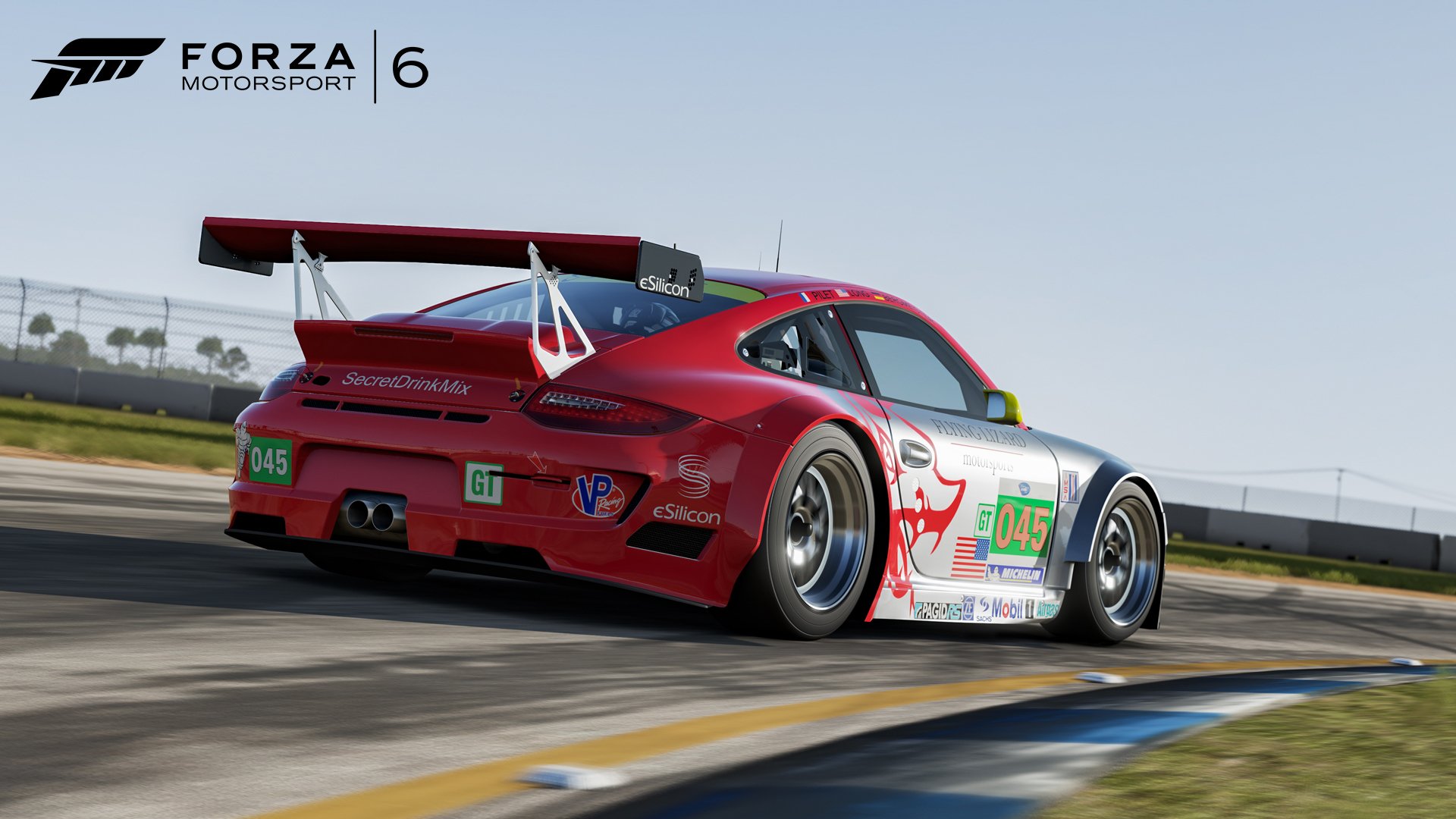 HD PC desktop wallpaper and background showing a red Porsche race car rounding a corner in the Forza Motorsport 6 video game, rear three-quarter view with sponsor decals and track curbing.