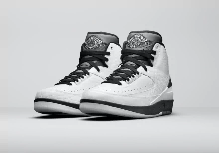 HD desktop wallpaper featuring a pair of white Air Jordan shoes against a grey background.