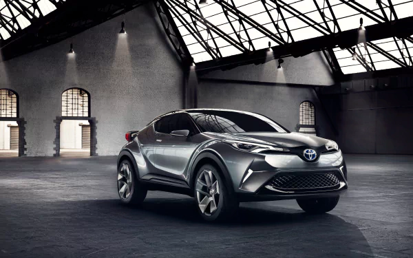 Silver Toyota C-HR concept SUV showcased in a spacious industrial setting, captured in 4K Ultra HD for a striking PC desktop wallpaper and background.