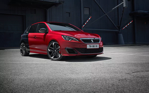 Red Peugeot 308 GTI compact car (Peugeot 308) parked in an industrial setting — Peugeot vehicle 2K Quad HD PC desktop wallpaper/background.