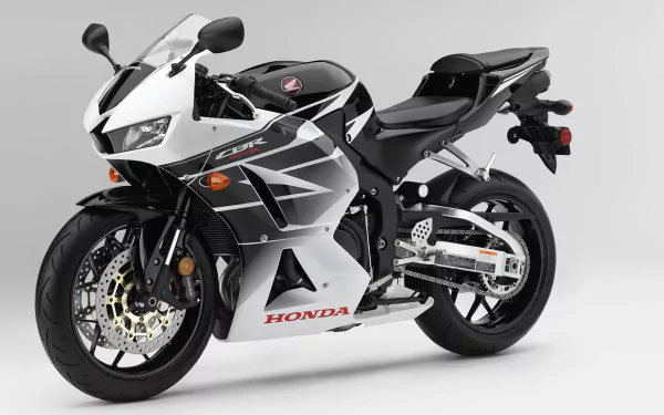HD PC desktop wallpaper background showing a white-and-black Honda CBR600RR sport motorcycle vehicle against a clean neutral backdrop.