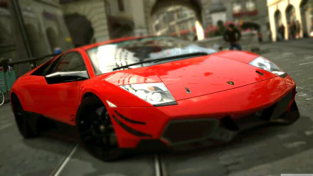 Low-angle 4K Ultra HD desktop wallpaper of a red Lamborghini Murcielago LP parked on a cobblestone street, highlighting its glossy finish and aggressive stance.