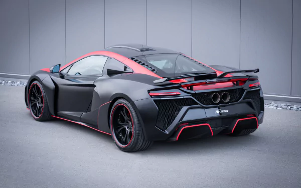 Sleek black McLaren 650S supercar shown from the rear, featuring bold red accents, captured in high detail for a 4K Ultra HD PC desktop wallpaper background.