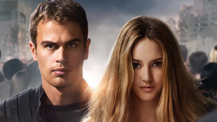 A dramatic HD wallpaper featuring characters from the movie Divergent, showcasing a powerful duo with intense expressions against a dynamic background.