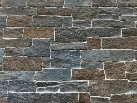 HD desktop wallpaper featuring a man-made slate stone wall pattern with varying shades of gray and brown, showcasing a textured, natural stone appearance.