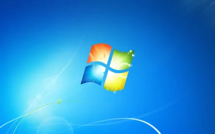A vibrant HD desktop wallpaper featuring the iconic Windows 7 logo against a soft blue background, showcasing a blend of technology and classic design elements.