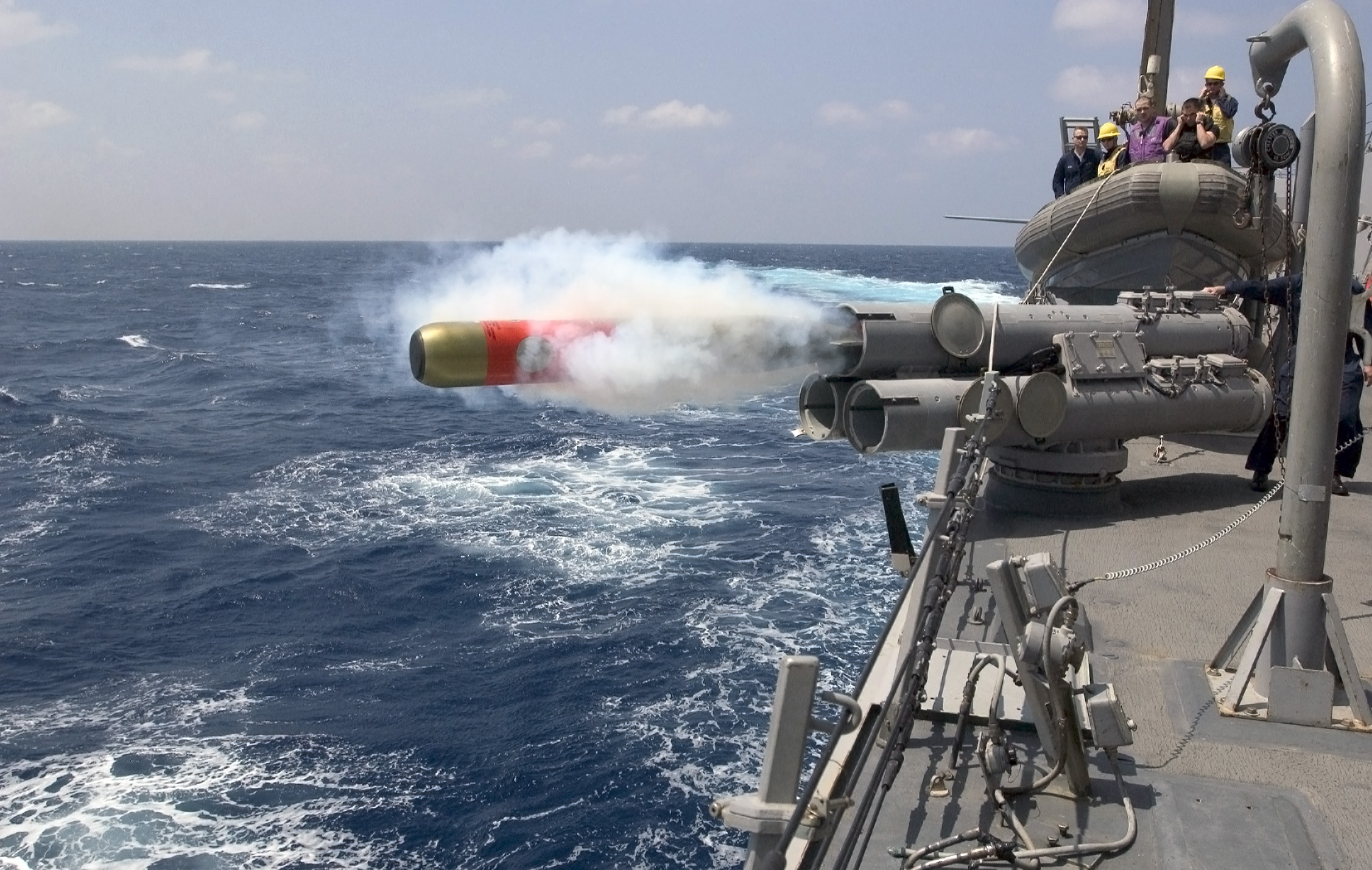 A MK-46 exercise torpedo is launched from the deck of the guided-missile destroyer USS Mustin (DDG 8 by John L. Beeman