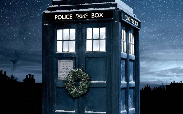 HD desktop wallpaper featuring the TARDIS from Doctor Who (2005) decorated with a Christmas wreath, set against a starry night sky.