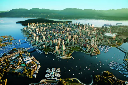 Aerial cityscape of Vancouver, Canada, showcasing its man-made urban skyline and waterfront in vibrant HD detail.
