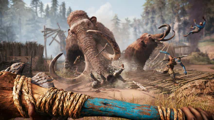 HD PC desktop wallpaper from Far Cry Primal featuring a fierce mammoth charge amid prehistoric tribal warriors in a forested village setting.