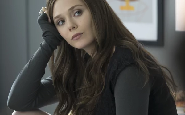 HD wallpaper featuring American actress Elizabeth Olsen as Scarlet Witch from the movie Captain America: Civil War, with long brunette hair, sitting thoughtfully with her head resting on her hand.