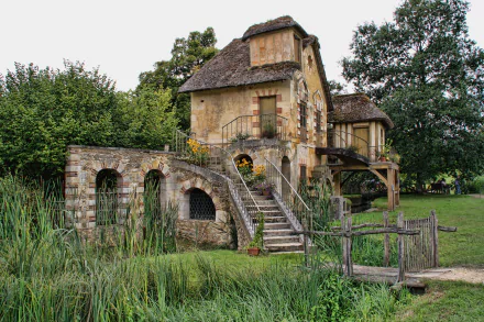 A charming man-made house near water, surrounded by greenery, inspired by the style of the Palace of Versailles in France, captured in 4K Ultra HD.
