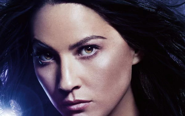 Olivia Munn as Psylocke from Marvel Comics, featured in X-Men: Apocalypse, with a striking gaze and dynamic lighting, creating a captivating HD wallpaper background.