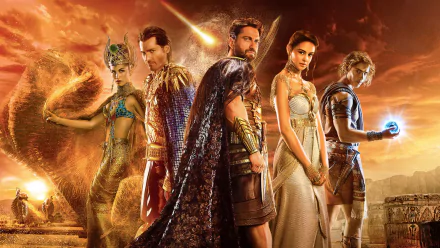 A striking HD wallpaper from the movie Gods Of Egypt, featuring key characters in dramatic poses against a vibrant, fiery background.
