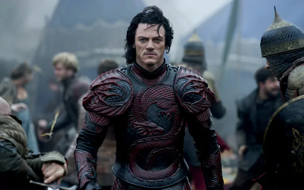 HD desktop wallpaper and background from the movie Dracula Untold, featuring a medieval warrior in elaborate armor standing amidst a chaotic battlefield scene.