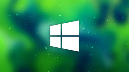 A vibrant green HD desktop wallpaper featuring the Windows 10 logo, set against a textured background that blends deep green hues and soft blur effects.