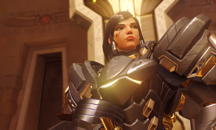Pharah from Overwatch stands confidently in her armored suit, depicted in a 4K Ultra HD video game wallpaper showcasing striking detail and lighting.