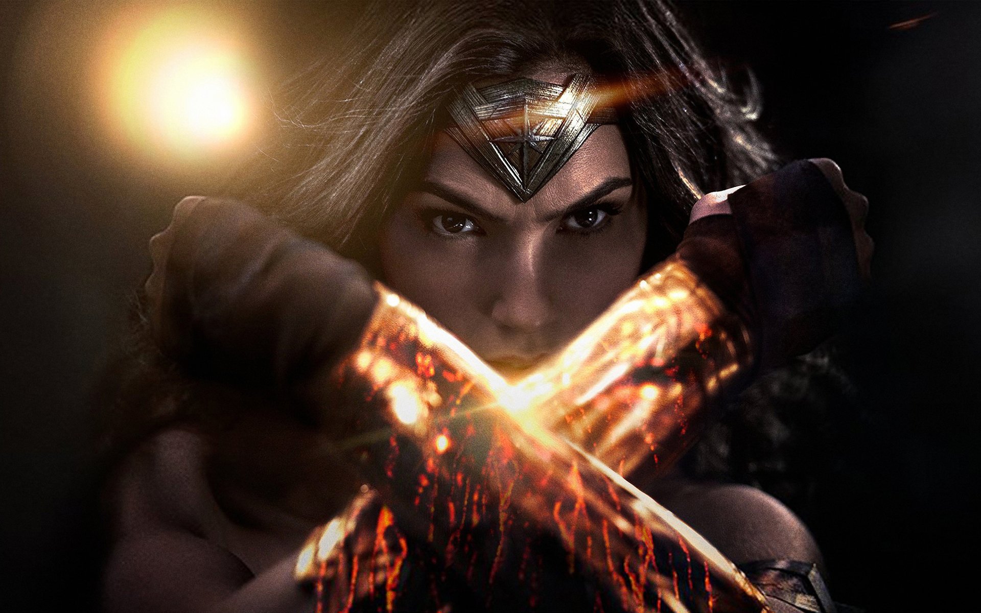 Gal Gadot as Wonder Woman, showcasing her iconic pose with glowing bracelets in this striking HD desktop wallpaper from Batman V Superman: Dawn of Justice.