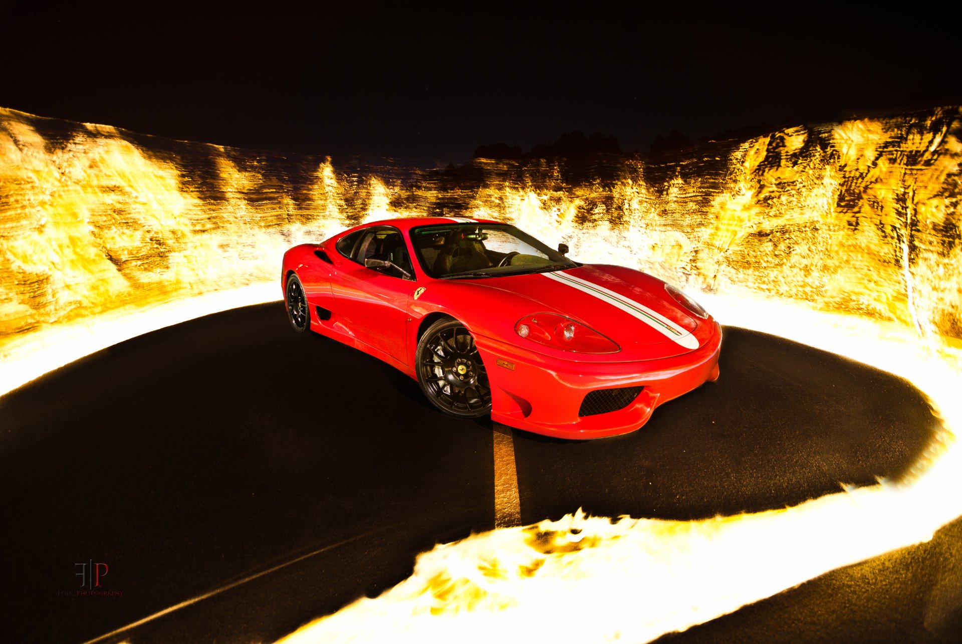 Red Ferrari 360 Challenge Stradale supercar on a dark road encircled by stylized flames — high-contrast 4K Ultra HD PC desktop wallpaper background