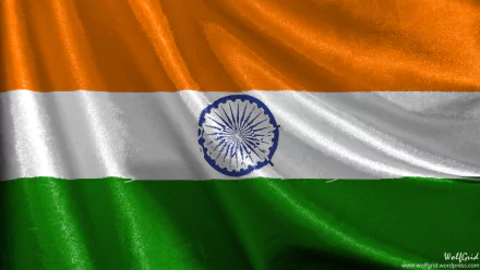 The image features the vibrant flag of India, showcasing its iconic saffron, white, and green stripes, along with the Ashoka Chakra, serving as a striking HD desktop wallpaper.