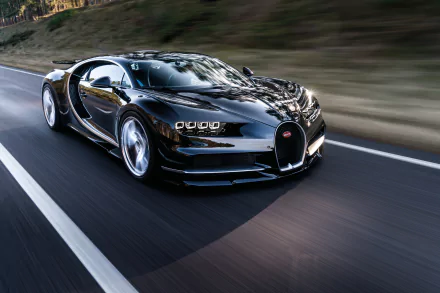 A high-definition desktop wallpaper featuring a sleek black Bugatti Chiron supercar driving on a road.