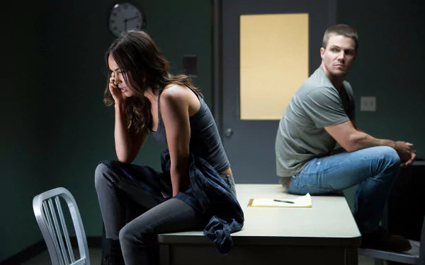 A dramatic scene from Teenage Mutant Ninja Turtles: Out of the Shadows, featuring Casey Jones (Stephen Amell) and April O’Neil (Megan Fox) in an intense moment.