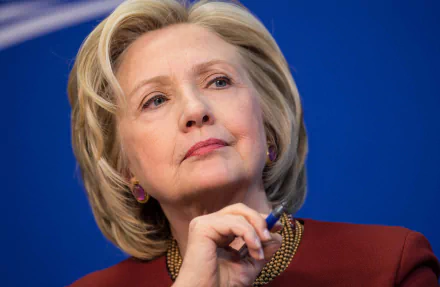 HD desktop wallpaper featuring a thoughtful woman in a red outfit against a blue background, providing a professional and polished look.