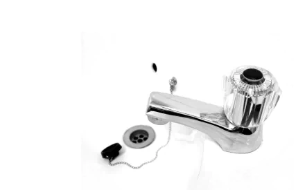 HD PC desktop wallpaper showing a man-made chrome water tap with chain and drain stopper on a white background.