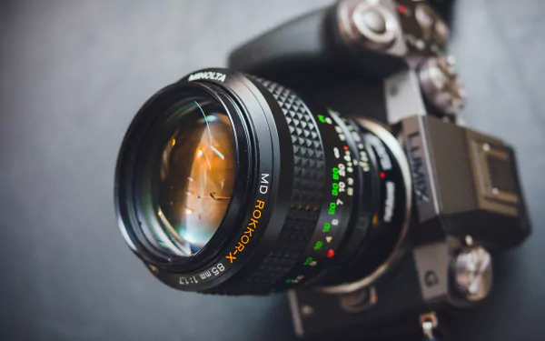 Close-up of a Lumix camera lens with detailed focus markings, captured in 4K Ultra HD as a sharp PC desktop wallpaper and background.