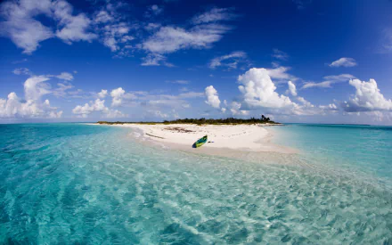 Tropical island surrounded by clear ocean waters with a canoe resting on the white sandy shore beneath a bright sky on the horizon in this HD desktop wallpaper.