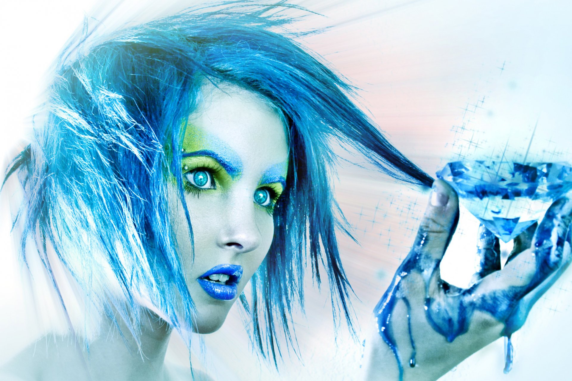 HD desktop wallpaper featuring an artistic portrayal of a woman with vivid blue hair and makeup, holding a faceted crystal, her hand painted in blue.