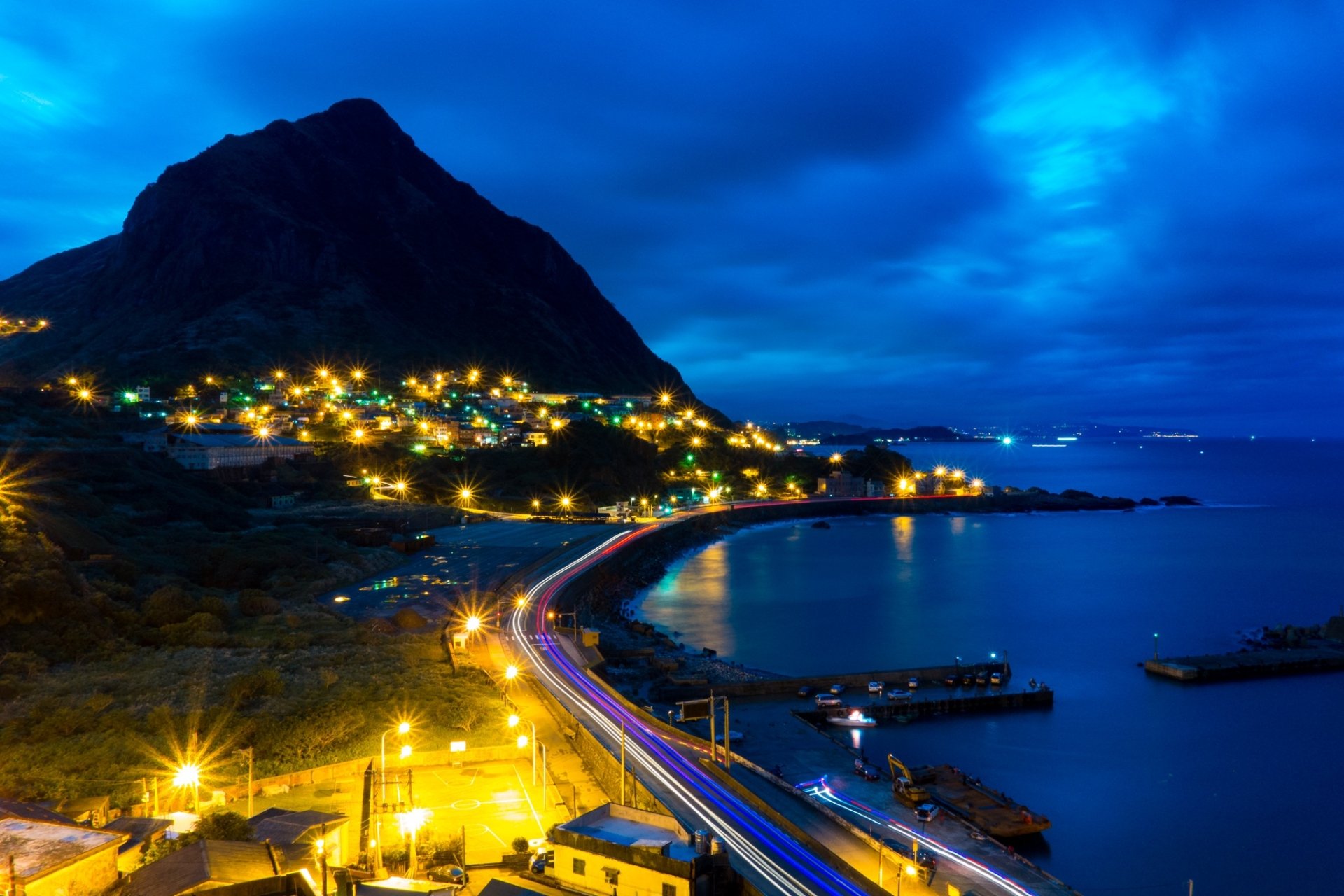 Download Road Ocean Time Lapse Night Light Mountain Man Made Town HD Wallpaper by Unsplash