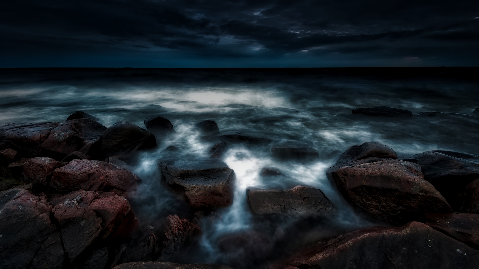 HD PC desktop wallpaper and background: HDR nature ocean scene with rocky shore, misty long-exposure waves and a moody sky meeting the horizon.