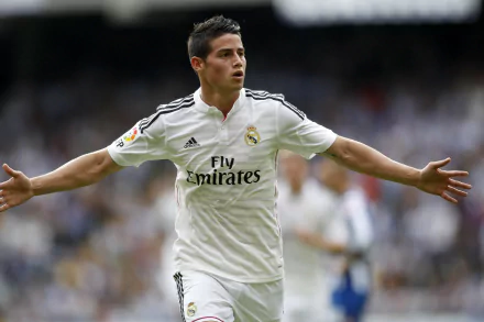 James Rodriguez celebrating a goal in a Real Madrid C.F. jersey, captured in a high-definition desktop wallpaper and background.