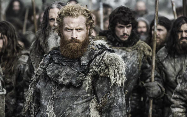 Tormund Giantsbane, portrayed by Kristofer Hivju in Game of Thrones, stands fiercely amidst a rugged group, captured in a detailed 4K Ultra HD TV show wallpaper.