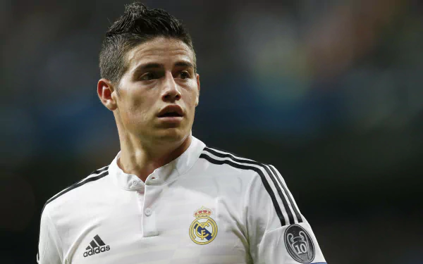 James Rodriguez in a Real Madrid C.F. jersey, showcasing his focus during a match. This high-definition image captures the essence of sports passion and dedication.