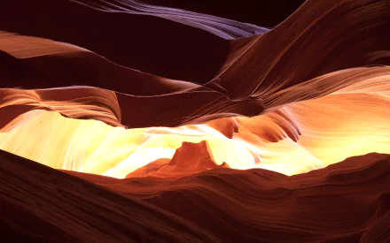 HD desktop wallpaper featuring the stunning natural curves and light beams of Arizona's Antelope Canyon.
