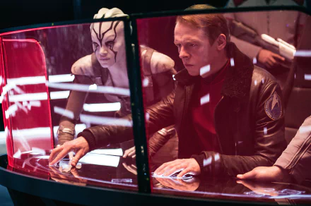 Simon Pegg as Montgomery Scott and Sofia Boutella as Jaylah from Star Trek Beyond in a 4K Ultra HD PC desktop wallpaper scene inside a spaceship cockpit.