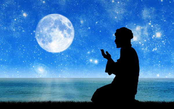  Man saying his prayer in beautiful view of moon