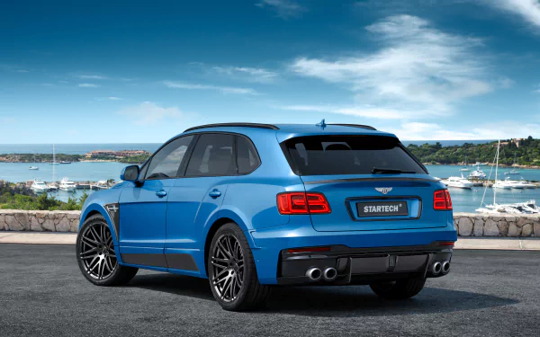 A blue Bentley Bentayga SUV parked by a waterfront, captured in 4K Ultra HD as a PC desktop wallpaper and background.