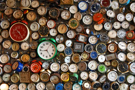 A vibrant collection of various clocks, showcasing intricate designs and colors, fills the frame, serving as a striking 4K Ultra HD PC desktop wallpaper and background.