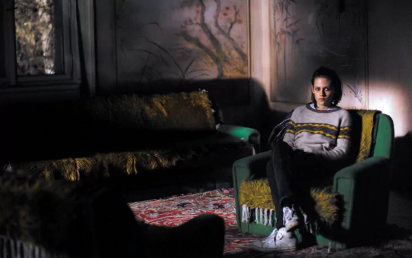 Kristen Stewart in a dimly lit scene from the movie Personal Shopper, featured as an HD PC desktop wallpaper and background.