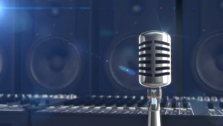 A vintage microphone stands in the foreground with large speakers in the background, set against a softly lit blue backdrop, creating an inspiring music-themed HD desktop wallpaper.