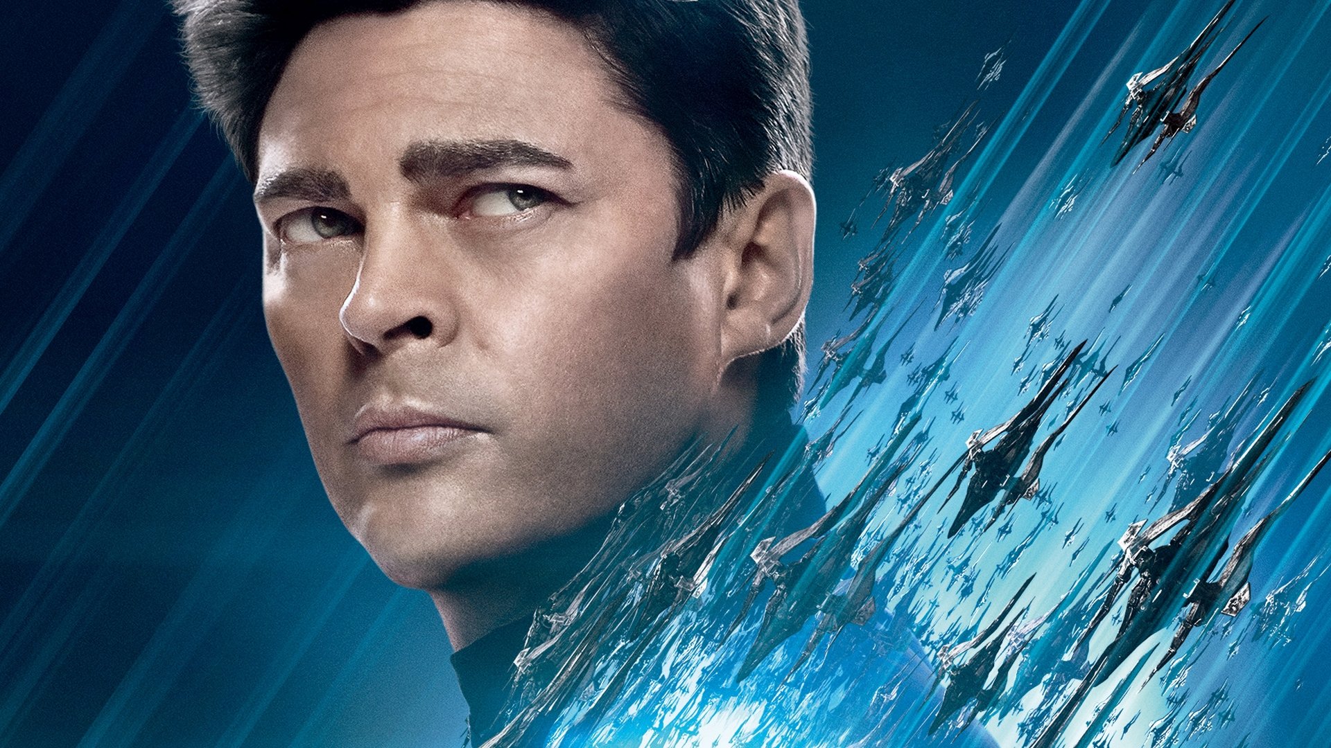 4K Ultra HD wallpaper featuring Karl Urban as Leonard McCoy (Bones) from the movie Star Trek Beyond, with starships flying through a dynamic blue background.
