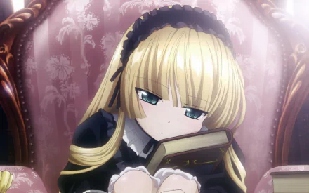A contemplative character from the anime Gosick, resting on a richly upholstered chair with a book in her lap, showcases a blend of elegance and intrigue in this HD desktop wallpaper.