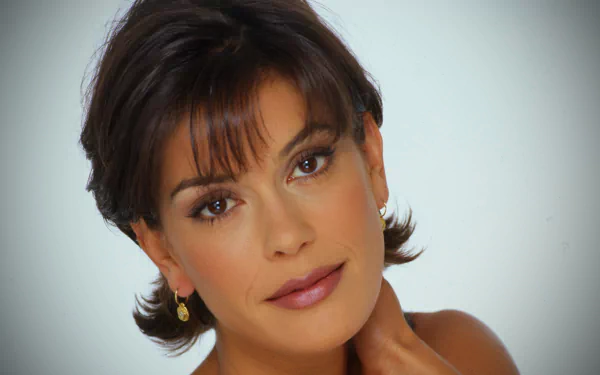 Close-up portrait of American actress Teri Hatcher with brunette hair and brown eyes, featured as an HD PC desktop wallpaper and background.